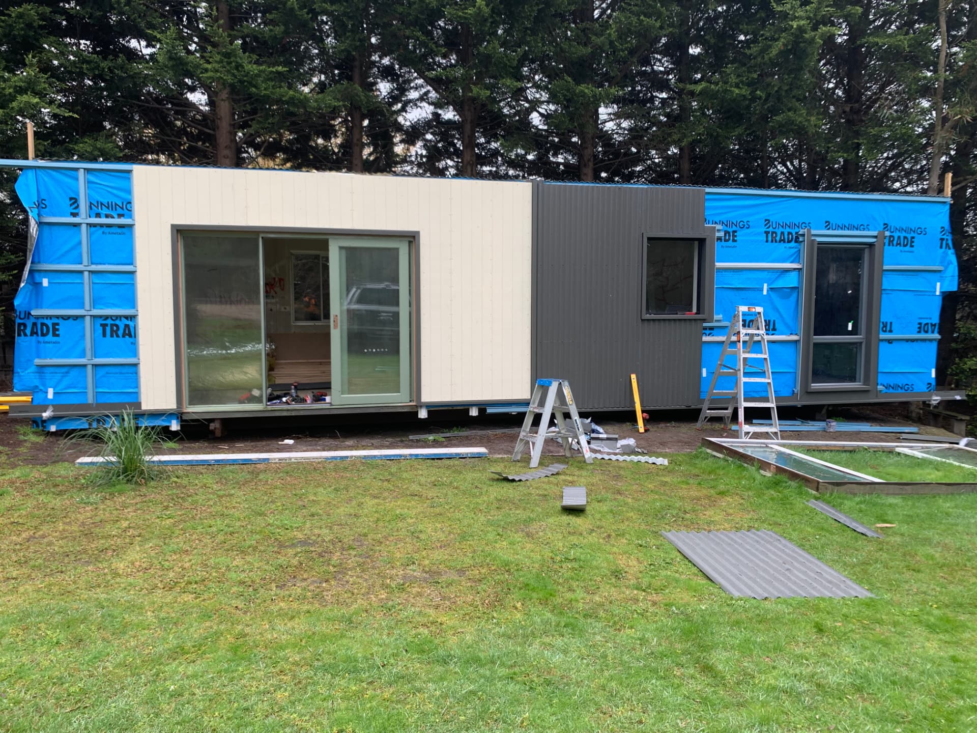 Corrugated metal cladding being installed on a new build