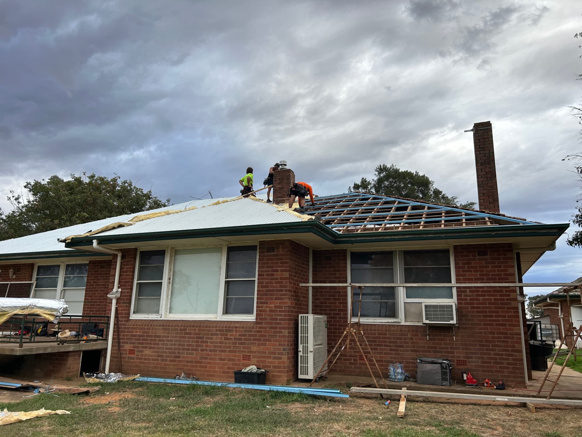 Re-roofing in progress with new battens and insulation