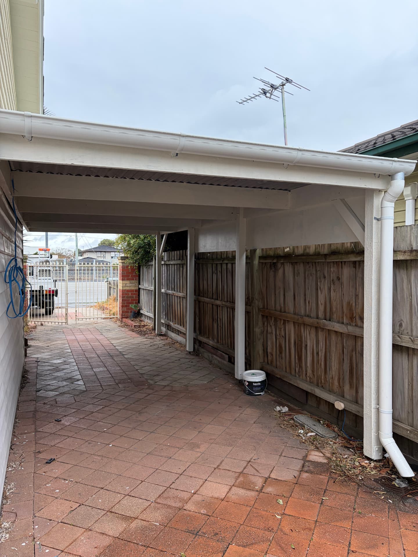 New white gutters and downpipes on a carport