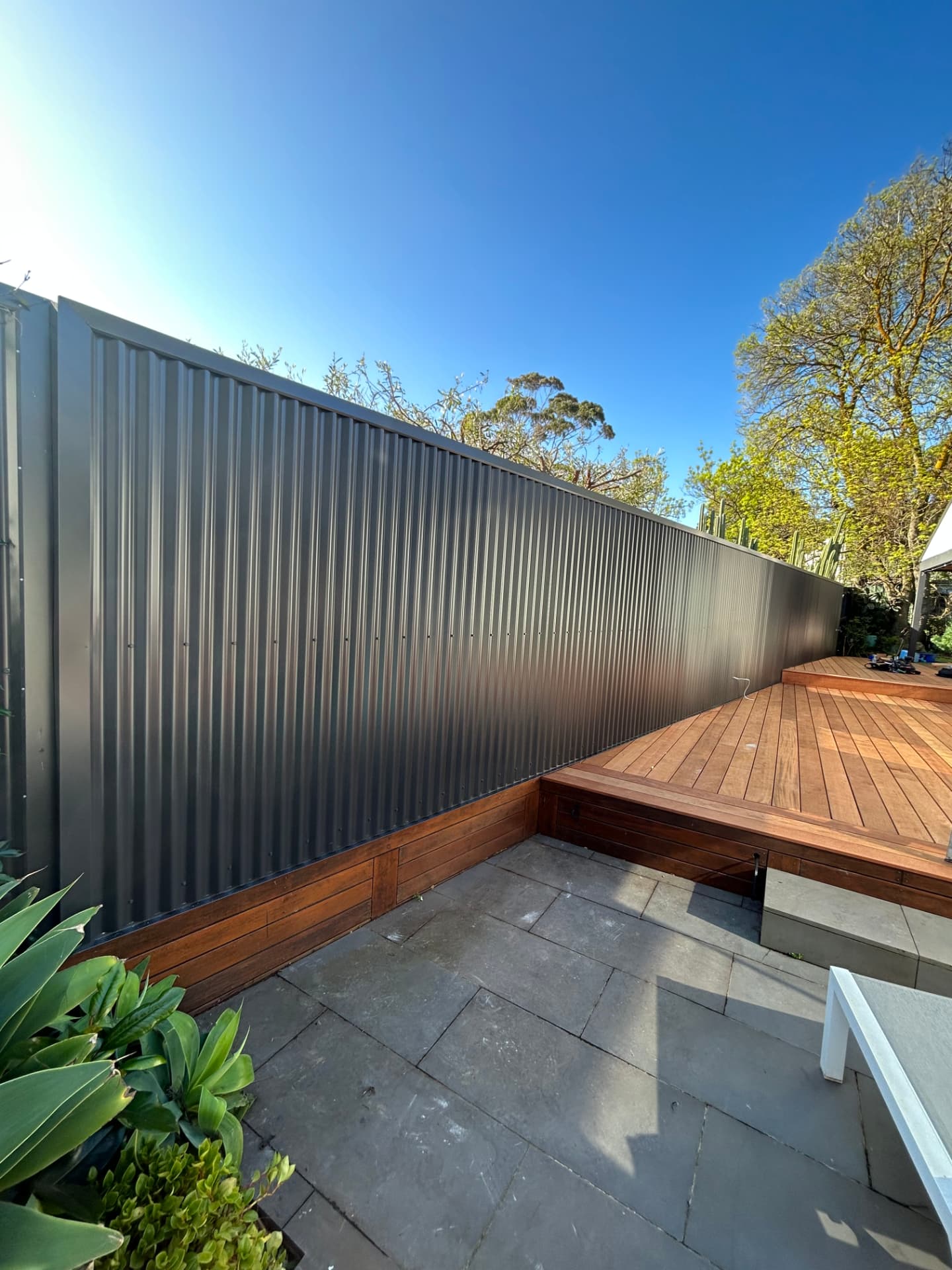 Corrugated metal cladding beside a timber deck